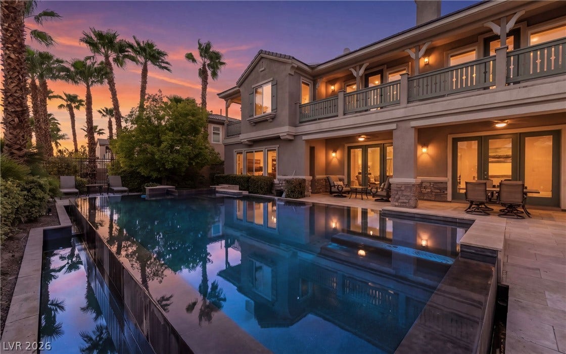 1343 Quiet River Avenue, Henderson, NV 89012 A sparkling negative-edge swimming pool highlights this multi-level exterior and stone-accented patio area.