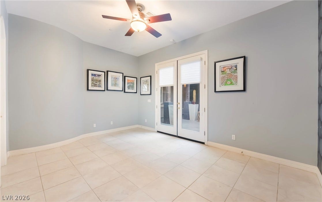 1343 Quiet River Avenue, Henderson, NV 89012 Tile flooring and French doors leading outside define this versatile room.