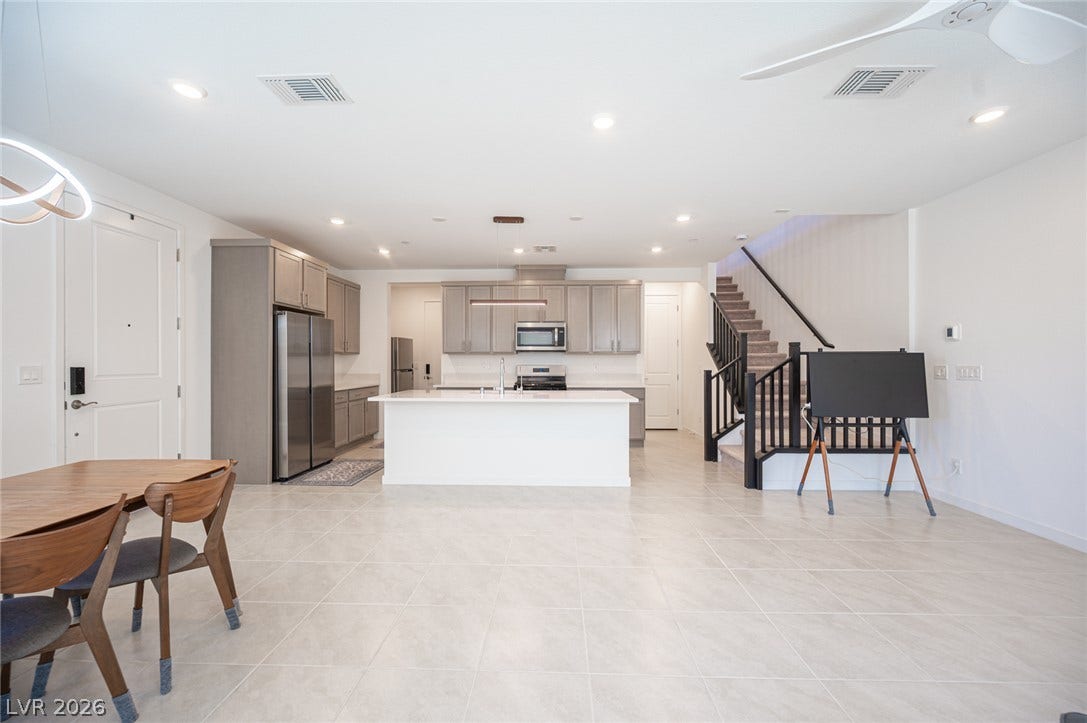 2545 Monolith Street, Las Vegas, NV 89138 Clean tile flooring and modern recessed lighting define this versatile open-concept main level.