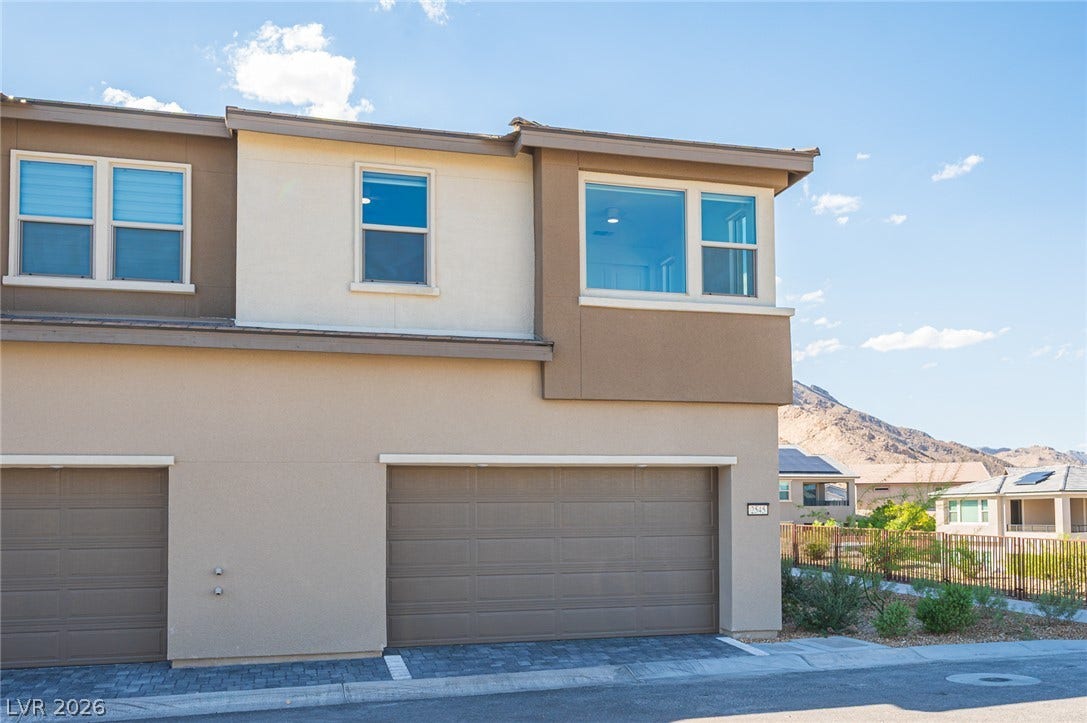 2545 Monolith Street, Las Vegas, NV 89138 A modern exterior features clean architectural lines and an attached two-car garage.