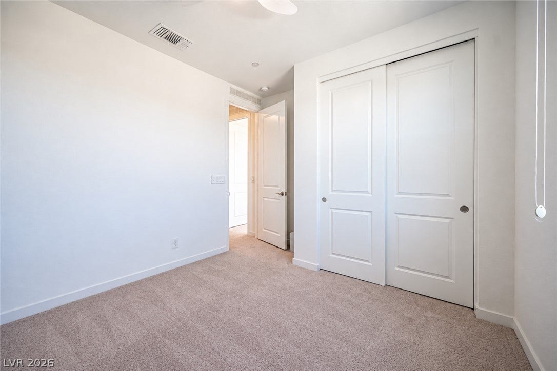 2545 Monolith Street, Las Vegas, NV 89138 Soft carpeting pairs with neutral walls in this comfortable secondary bedroom.
