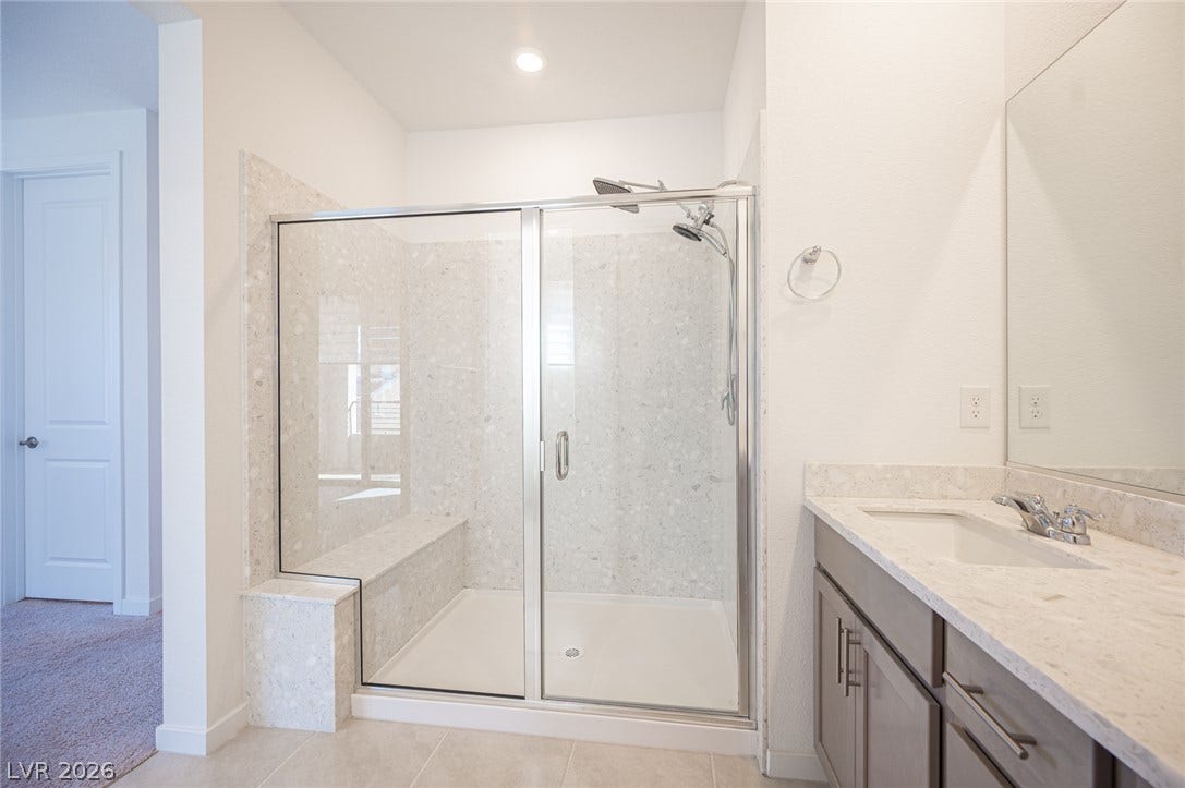 2545 Monolith Street, Las Vegas, NV 89138 Clean lines and a spacious walk-in shower define this modern primary bathroom.