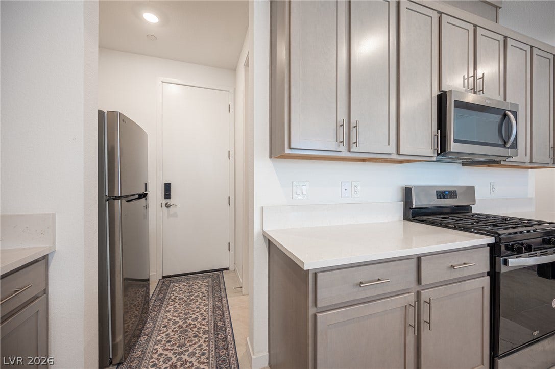 2545 Monolith Street, Las Vegas, NV 89138 Streamlined cabinetry and gleaming countertops define this modern cooking space.