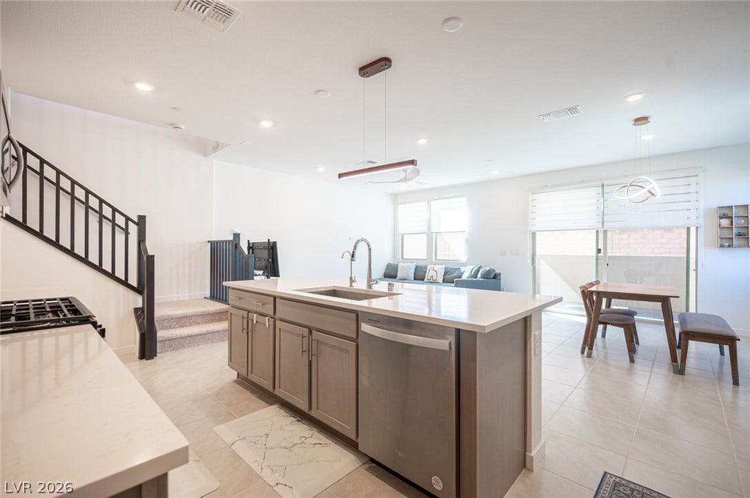2545 Monolith Street, Las Vegas, NV 89138 An open floorplan seamlessly connects the contemporary kitchen to the dining and living spaces.