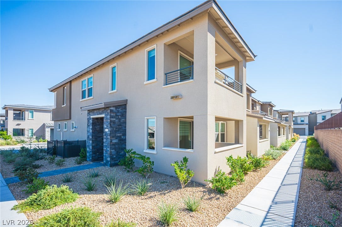 2545 Monolith Street, Las Vegas, NV 89138 Modern multi-level exterior architecture features clean lines, stone accents, and desert landscaping.