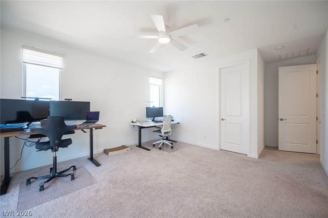 2545 Monolith Street, Las Vegas, NV 89138 Plentiful natural light fills a versatile room finished with neutral carpeting.