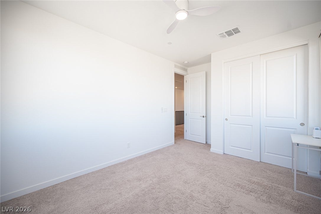 2545 Monolith Street, Las Vegas, NV 89138 Plush carpeting and clean lines define this modern bedroom space.
