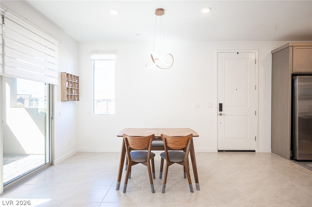 2545 Monolith Street, Las Vegas, NV 89138 Ceramic tile floors and sliding glass doors enhance this light-filled dining space.