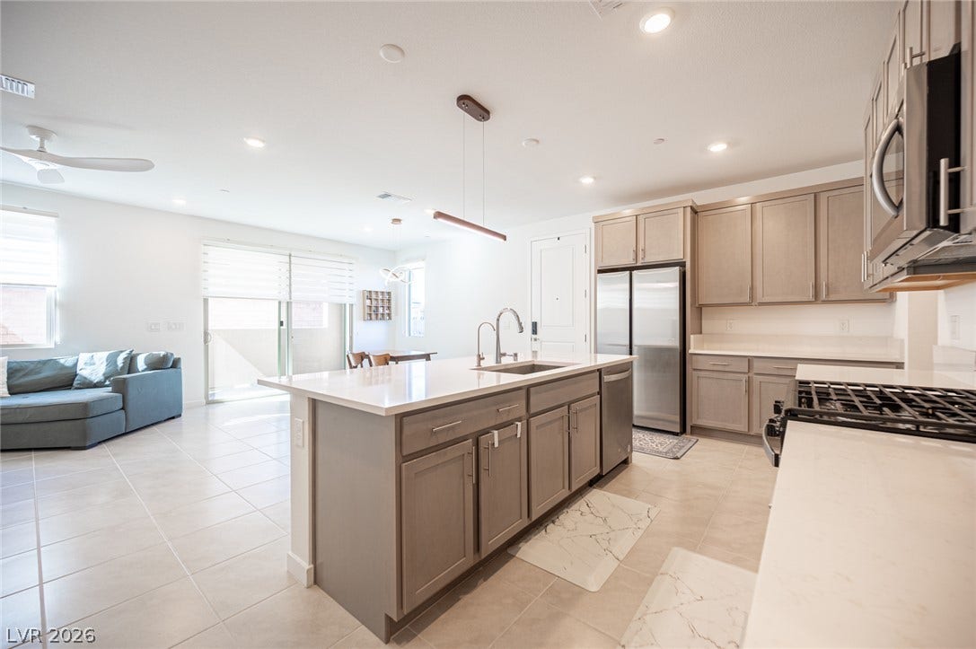 2545 Monolith Street, Las Vegas, NV 89138 An open floorplan connects the modern kitchen directly to the spacious living area.
