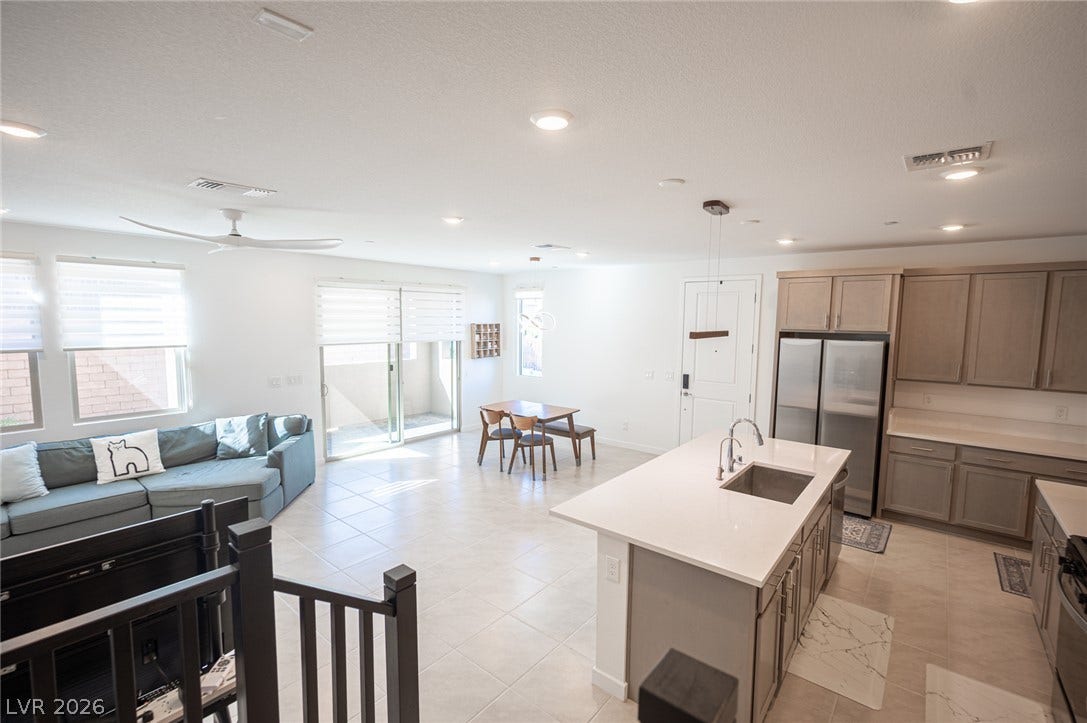 2545 Monolith Street, Las Vegas, NV 89138 Clean tile flooring and a functional central island anchor this airy open living area.