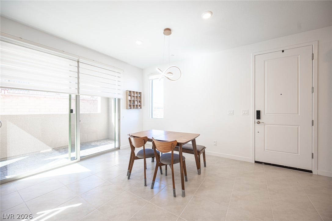 2545 Monolith Street, Las Vegas, NV 89138 Sliding glass doors open to a private patio from this tile-floored dining area.