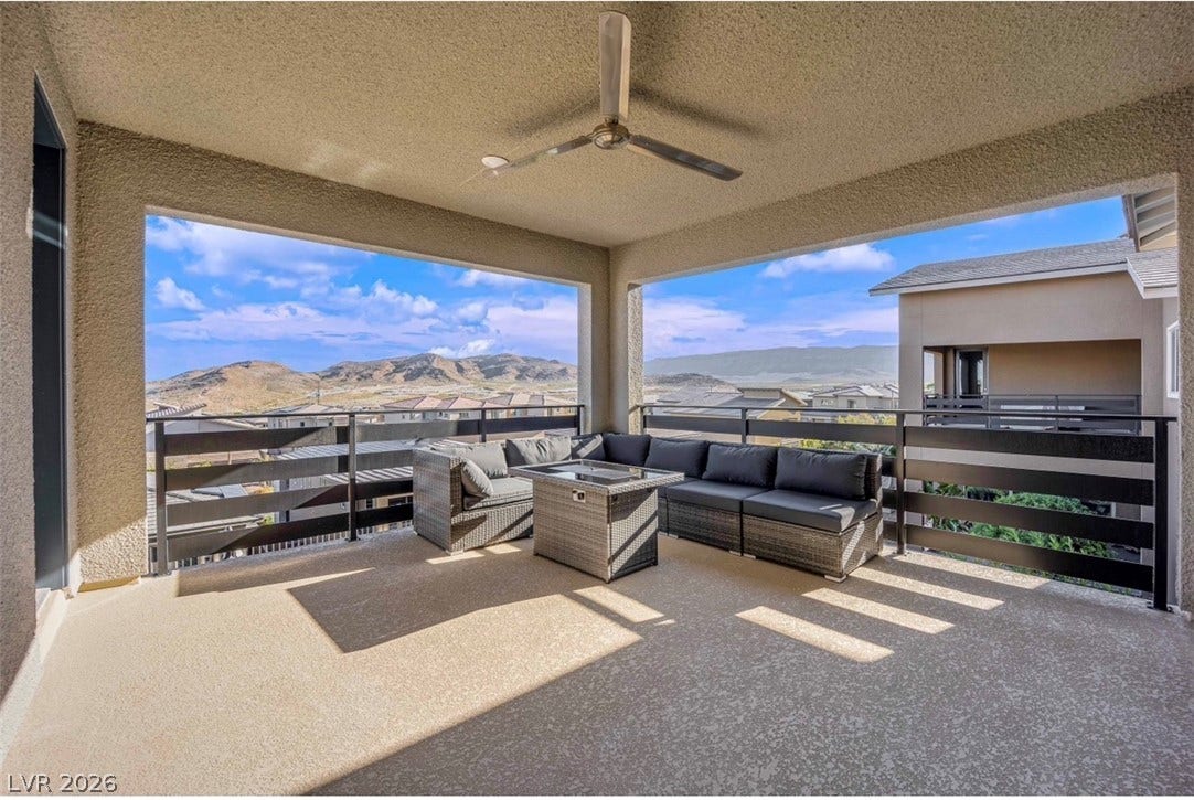12415 Aster Hills Avenue, Las Vegas, NV 89138 A spacious covered balcony frame displays panoramic views of distant rolling hills.