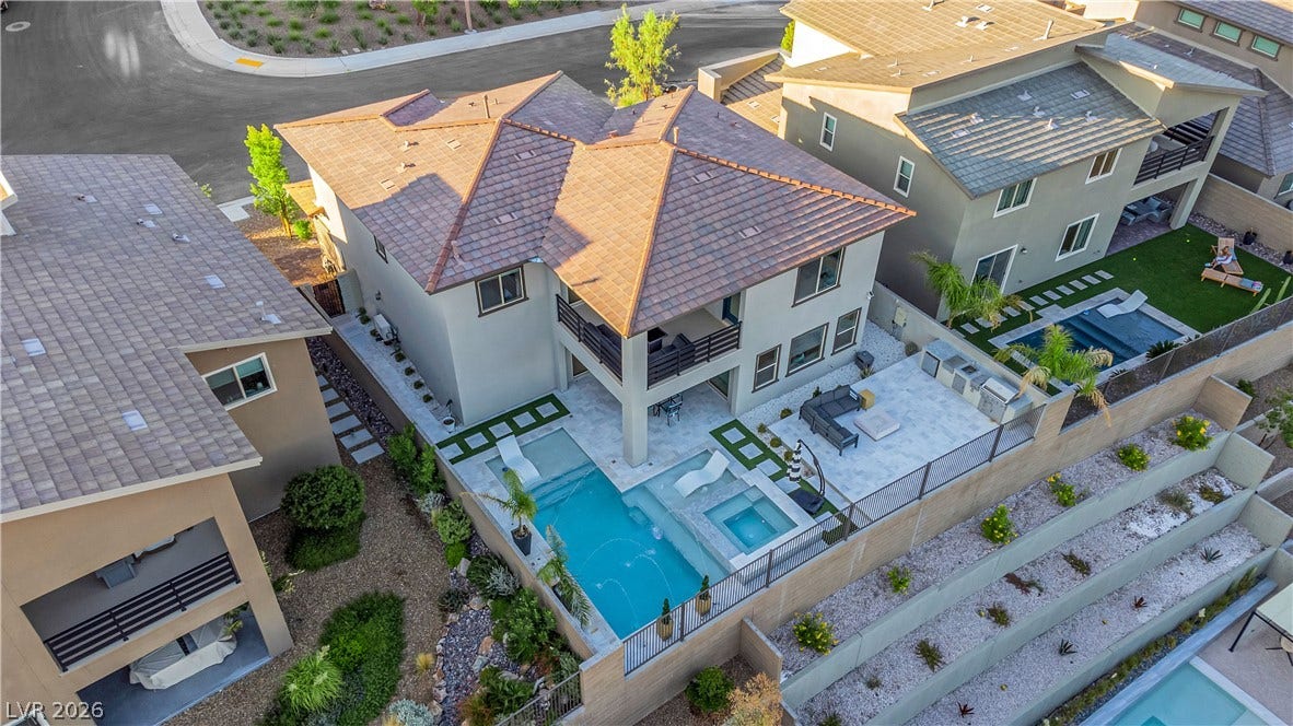 12415 Aster Hills Avenue, Las Vegas, NV 89138 An aerial perspective reveals a modern backyard oasis with a pristine swimming pool and spa.