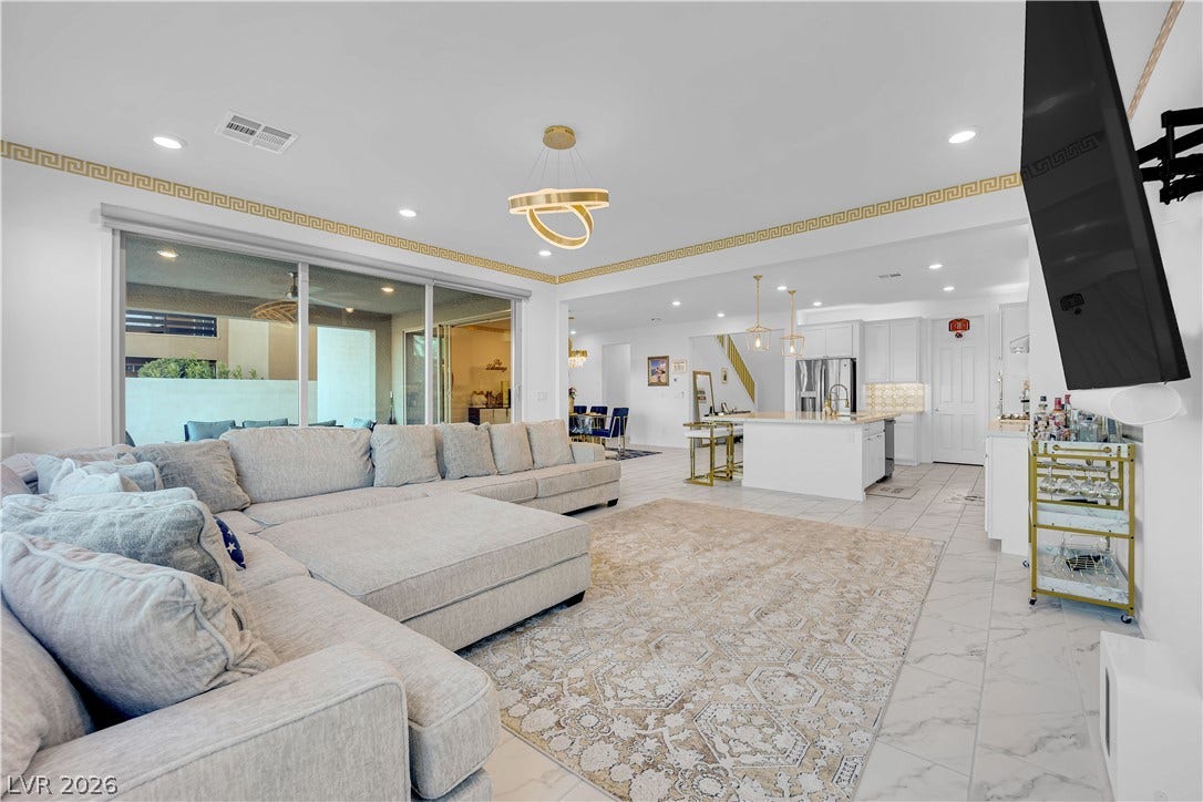 12415 Aster Hills Avenue, Las Vegas, NV 89138 An open-concept living area flows into the kitchen over elegant tile flooring.