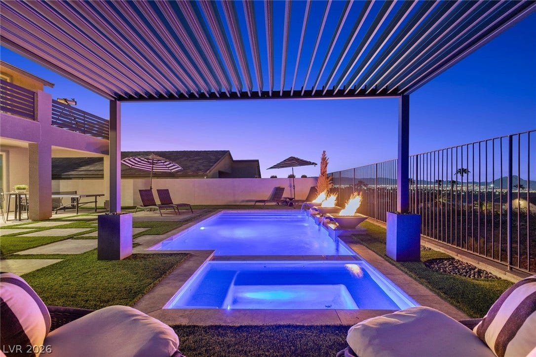 1976 Peaceful Mesa Court, Henderson, NV 89052 An inviting pool and spa rest under the shelter of a modern louvred pergola.