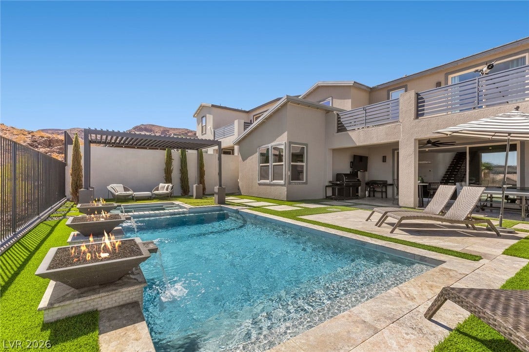 1976 Peaceful Mesa Court, Henderson, NV 89052 A sparkling pool with integrated fire features anchors this modern backyard retreat.