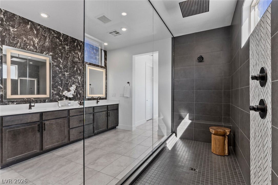 1976 Peaceful Mesa Court, Henderson, NV 89052 A spacious walk-in shower highlights this modern bath with clean lines and premium tilework.