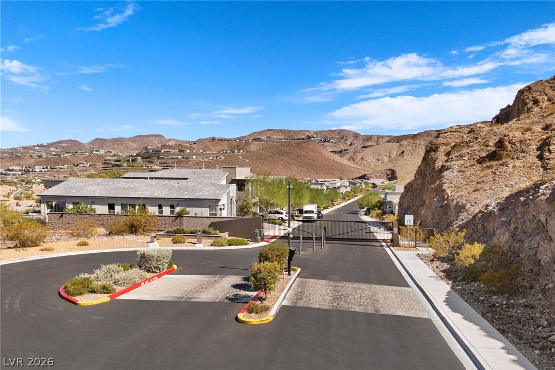 1976 Peaceful Mesa Court, Henderson, NV 89052 Secure gated access introduces this scenic desert neighborhood surrounded by rugged mountain terrain.