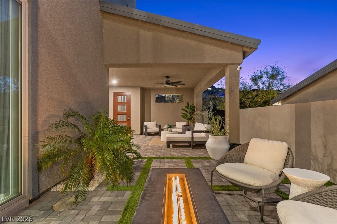 1976 Peaceful Mesa Court, Henderson, NV 89052 An inviting covered patio opens to a paved courtyard with a linear fire feature.