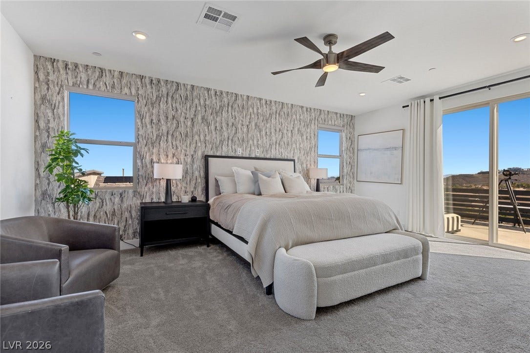 1976 Peaceful Mesa Court, Henderson, NV 89052 Plush carpeting underfoot complements large sliding glass doors leading to an outdoor balcony space.