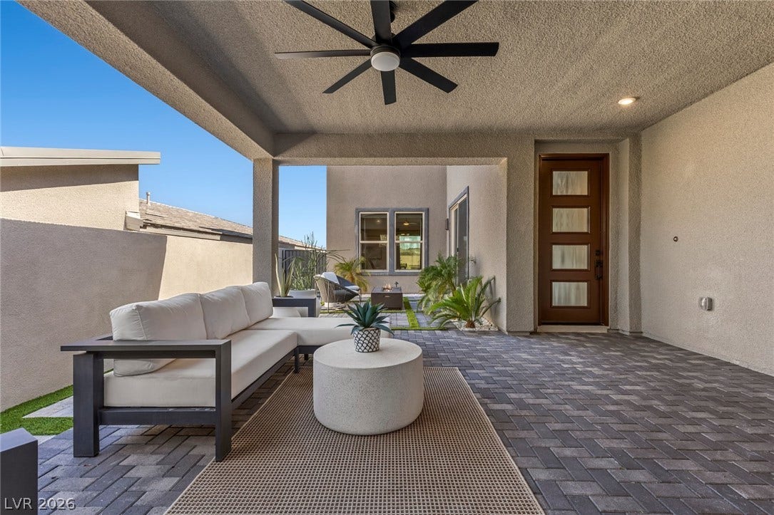 1976 Peaceful Mesa Court, Henderson, NV 89052 An inviting covered patio features extensive paver flooring and seamless transition to the backyard.