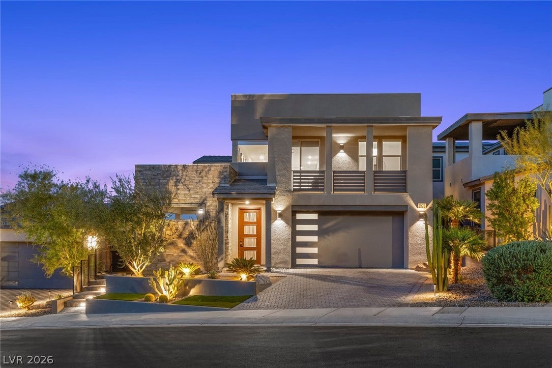 1976 Peaceful Mesa Court, Henderson, NV 89052 Striking contemporary architecture pairs beautifully with desert landscaping and stone accents under twilight skies.