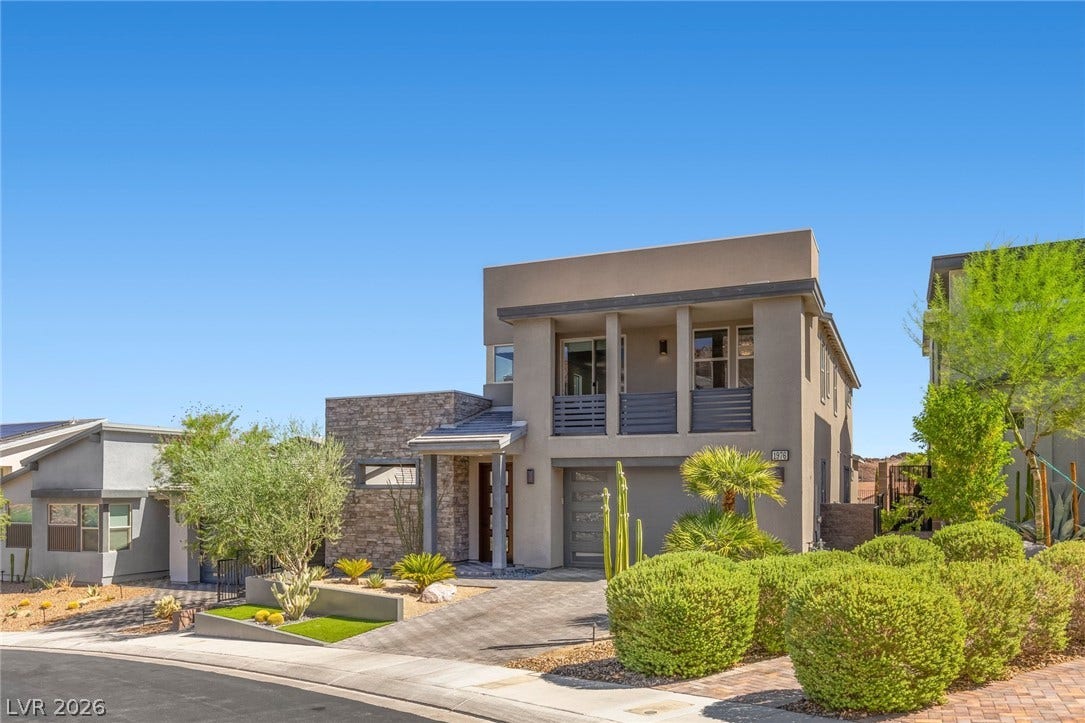 1976 Peaceful Mesa Court, Henderson, NV 89052 Modern desert architecture stands out with clean lines, stone accents, and manicured landscaping.