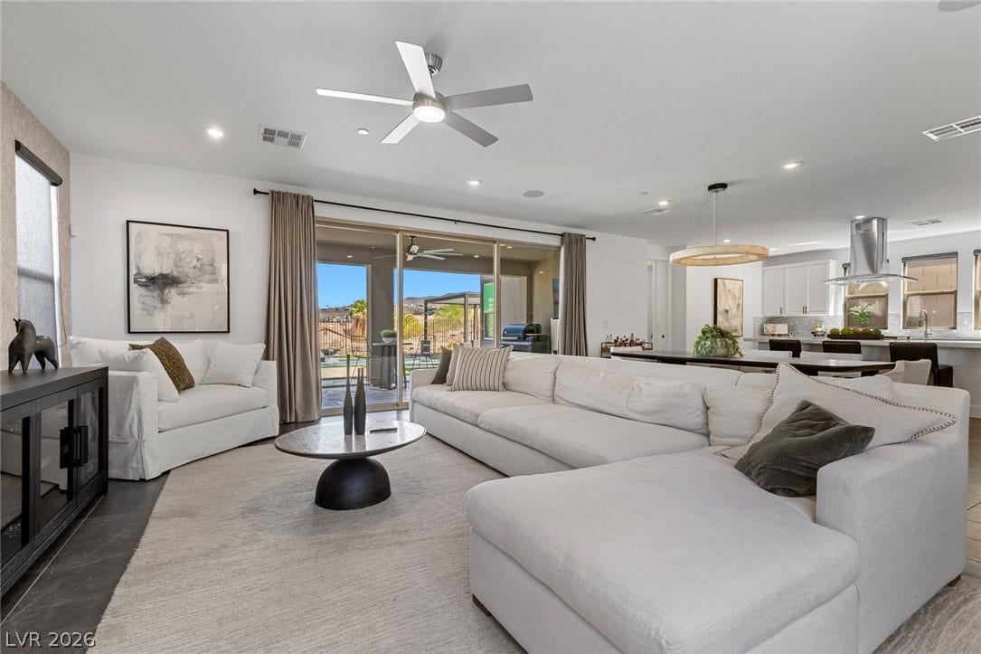 1976 Peaceful Mesa Court, Henderson, NV 89052 Sliding glass doors seamlessly connect this open living space to the outdoor patio.