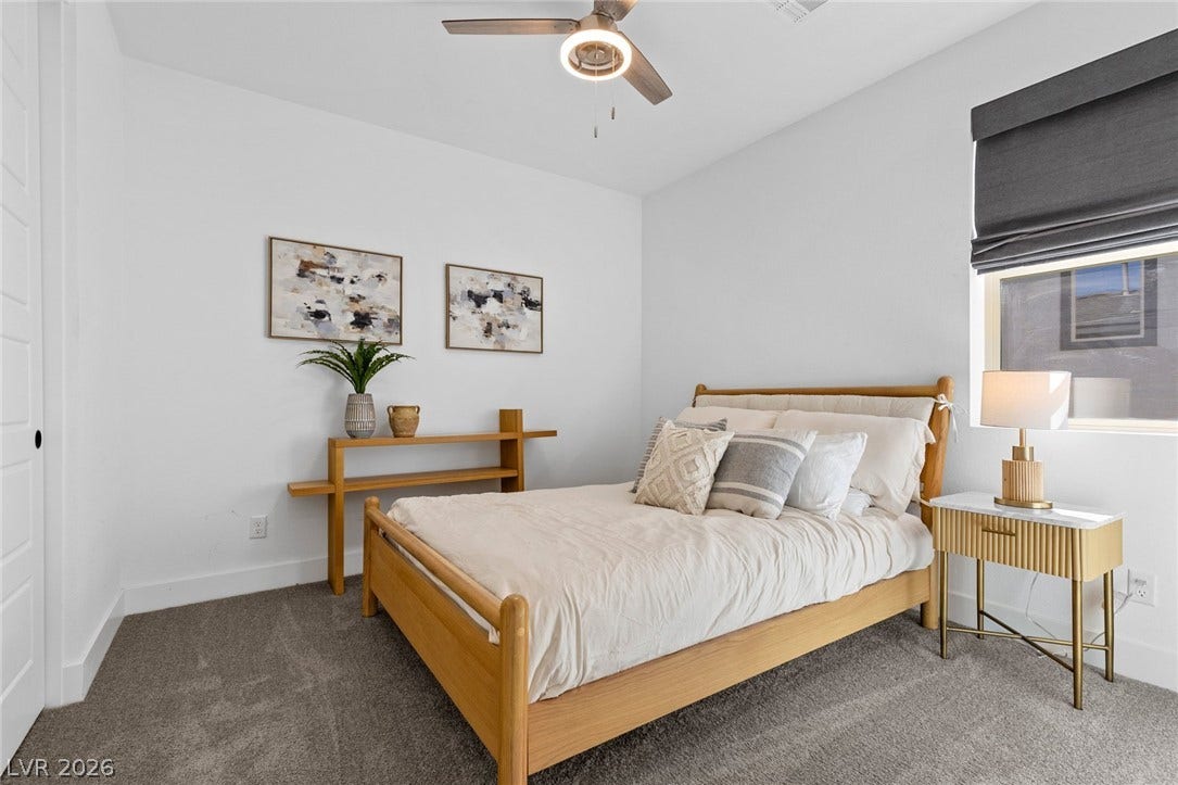 1976 Peaceful Mesa Court, Henderson, NV 89052 Plush carpeting and tall windows define this peaceful bedroom retreat.