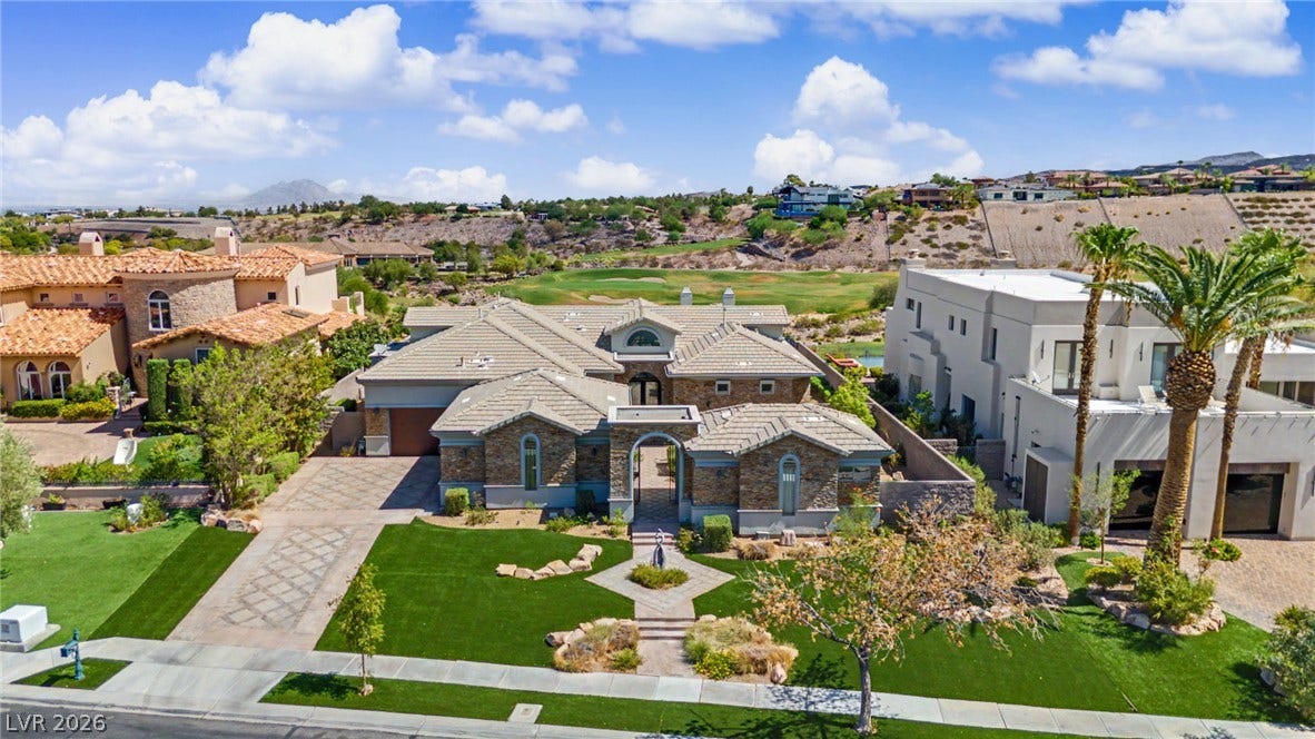 1358 Opal Valley Street, Henderson, NV 89052 Stunning, manicured lawns define this elegant desert estate.