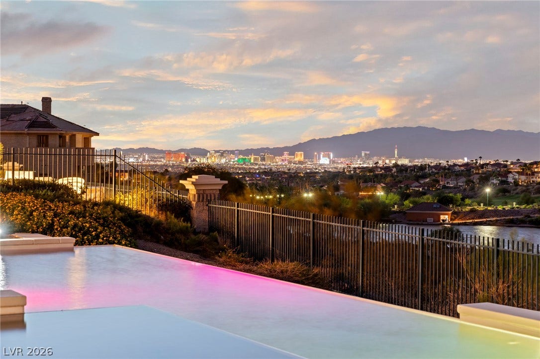 1358 Opal Valley Street, Henderson, NV 89052 Infinity Pool-Glittering Las Vegas Strip and mountain ridges frame this elevated backyard swimming pool panorama.