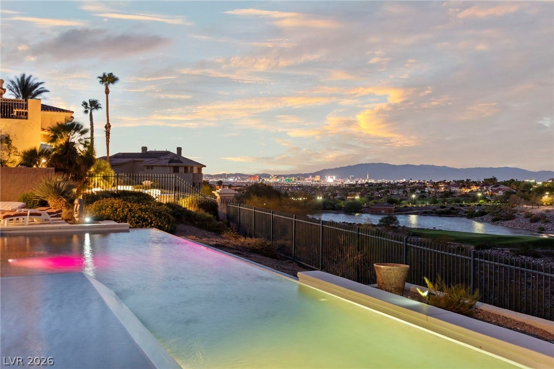 1358 Opal Valley Street, Henderson, NV 89052 Infinity Pool- an elevated View overlooking the Las Vegas Strip, city, mountains, and the Rio Secco Golf Course.