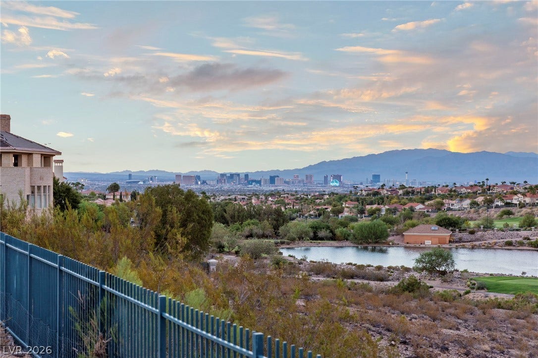1358 Opal Valley Street, Henderson, NV 89052 Panoramas of the distant Strip lights over the Rio Secco Golf Course.