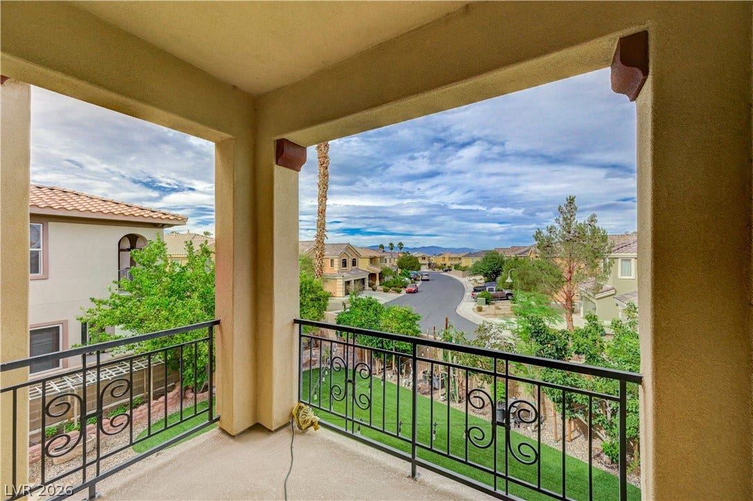 218 Crooked Putter Drive, Las Vegas, NV 89148 An elevated perspective overlooks the surrounding neighborhood from this covered concrete balcony.