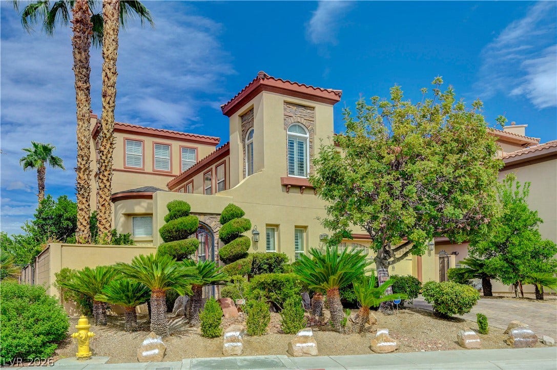 218 Crooked Putter Drive, Las Vegas, NV 89148 Spanish tile rooflines and manicured desert plantings create a striking architectural profile.