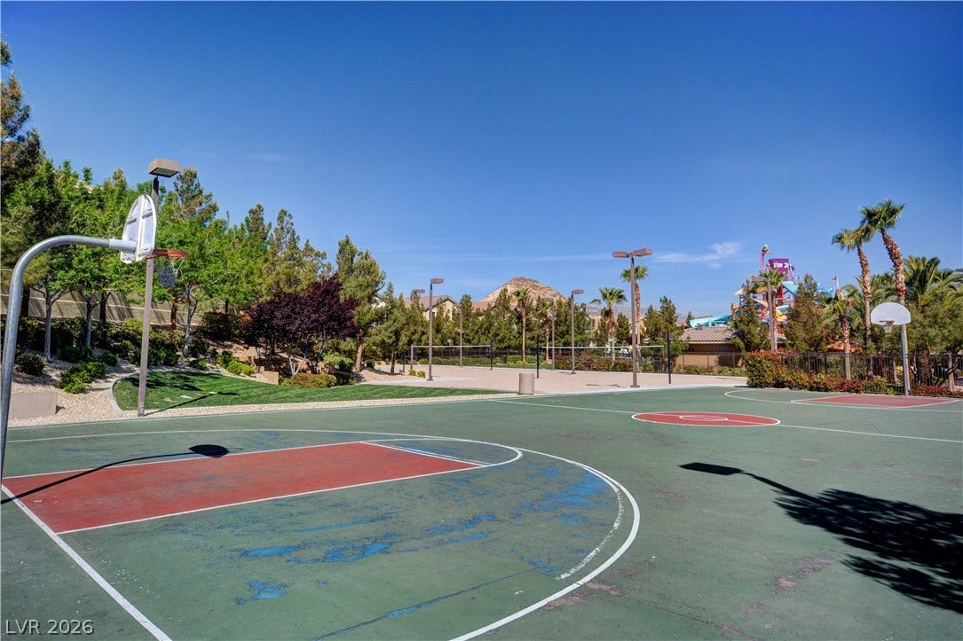 218 Crooked Putter Drive, Las Vegas, NV 89148 An outdoor basketball court provides recreational activity under clear desert skies.