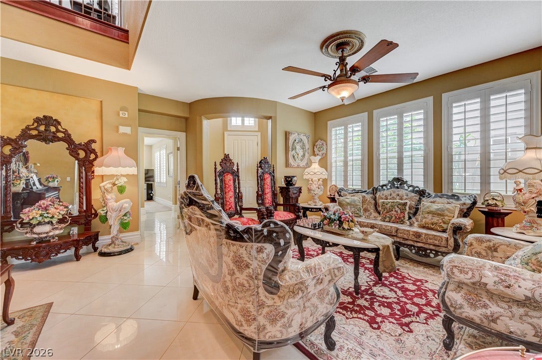 218 Crooked Putter Drive, Las Vegas, NV 89148 Polished tile flooring and plantation shutters define this open living area.