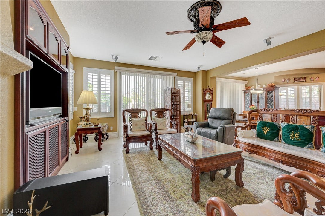 218 Crooked Putter Drive, Las Vegas, NV 89148 Polished tile flooring and integrated media cabinetry define this welcoming common area.