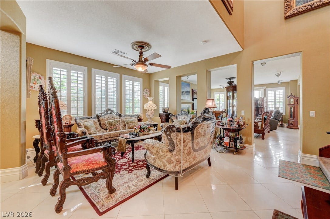 218 Crooked Putter Drive, Las Vegas, NV 89148 Polished tile flooring and multi-level ceilings define this open and airy formal gathering space.