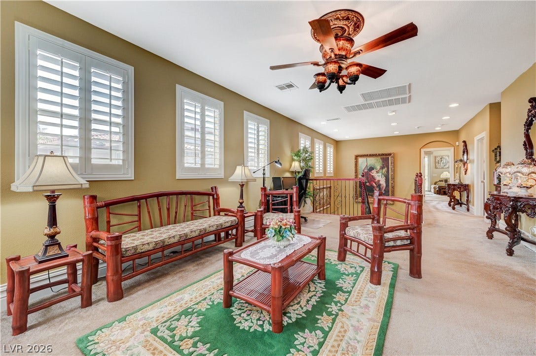 218 Crooked Putter Drive, Las Vegas, NV 89148 Plentiful natural light filters through multiple plantation shutters into a spacious upper-level living area.