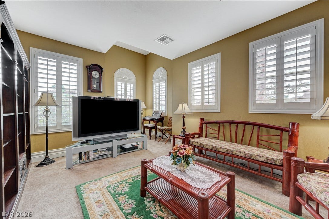 218 Crooked Putter Drive, Las Vegas, NV 89148 High ceilings and plantation shutters bring architectural distinction to this inviting living space.
