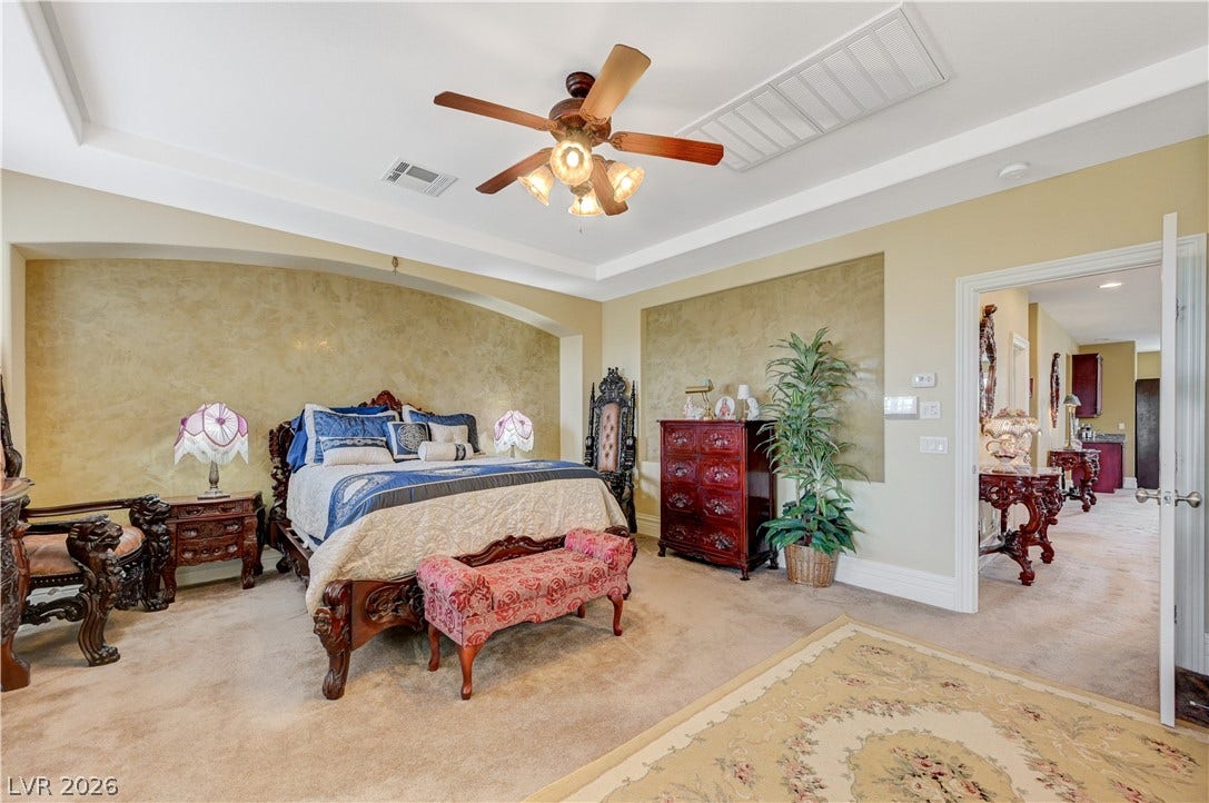 218 Crooked Putter Drive, Las Vegas, NV 89148 An elegant tray ceiling accents this comfortable sleeping space featuring plush wall-to-wall carpeting.
