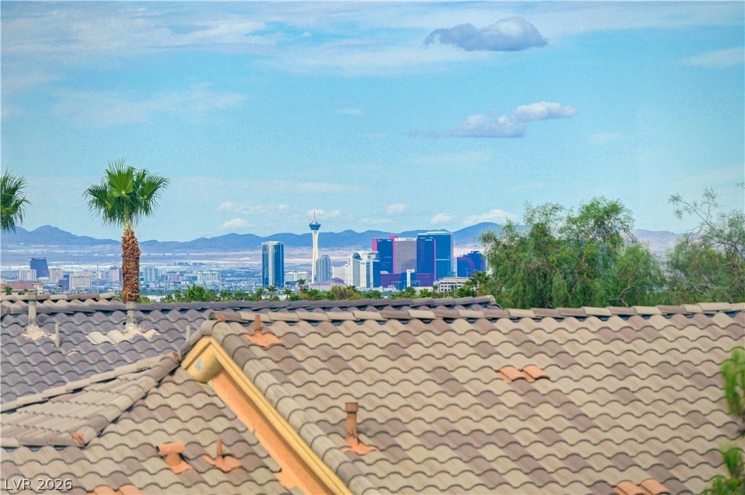 218 Crooked Putter Drive, Las Vegas, NV 89148 Distant skyline and mountain vistas unfold beyond the tiled roofline.