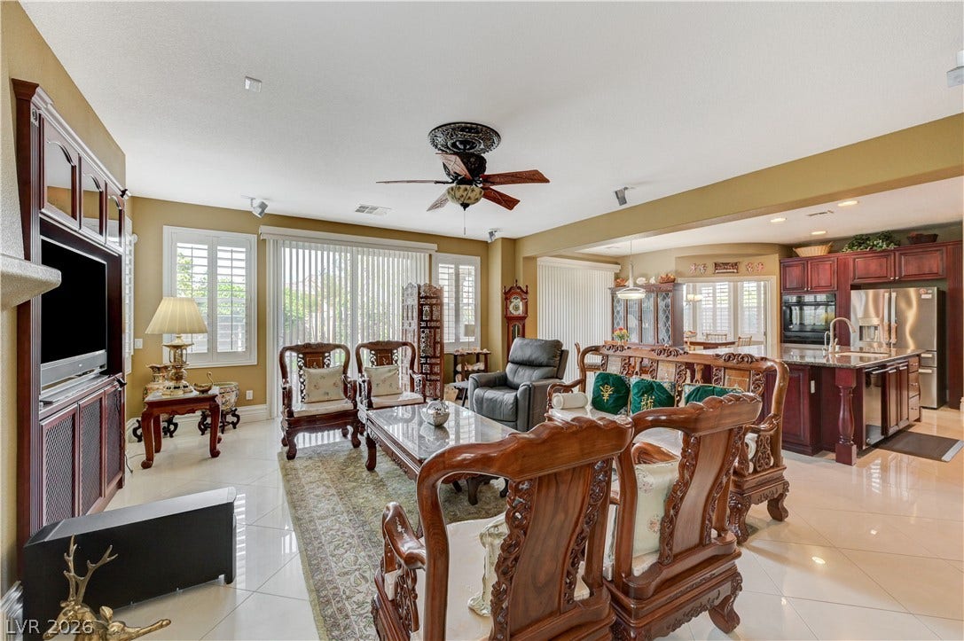 218 Crooked Putter Drive, Las Vegas, NV 89148 Polished tile flooring and an open layout seamlessly connect the living area to the kitchen.
