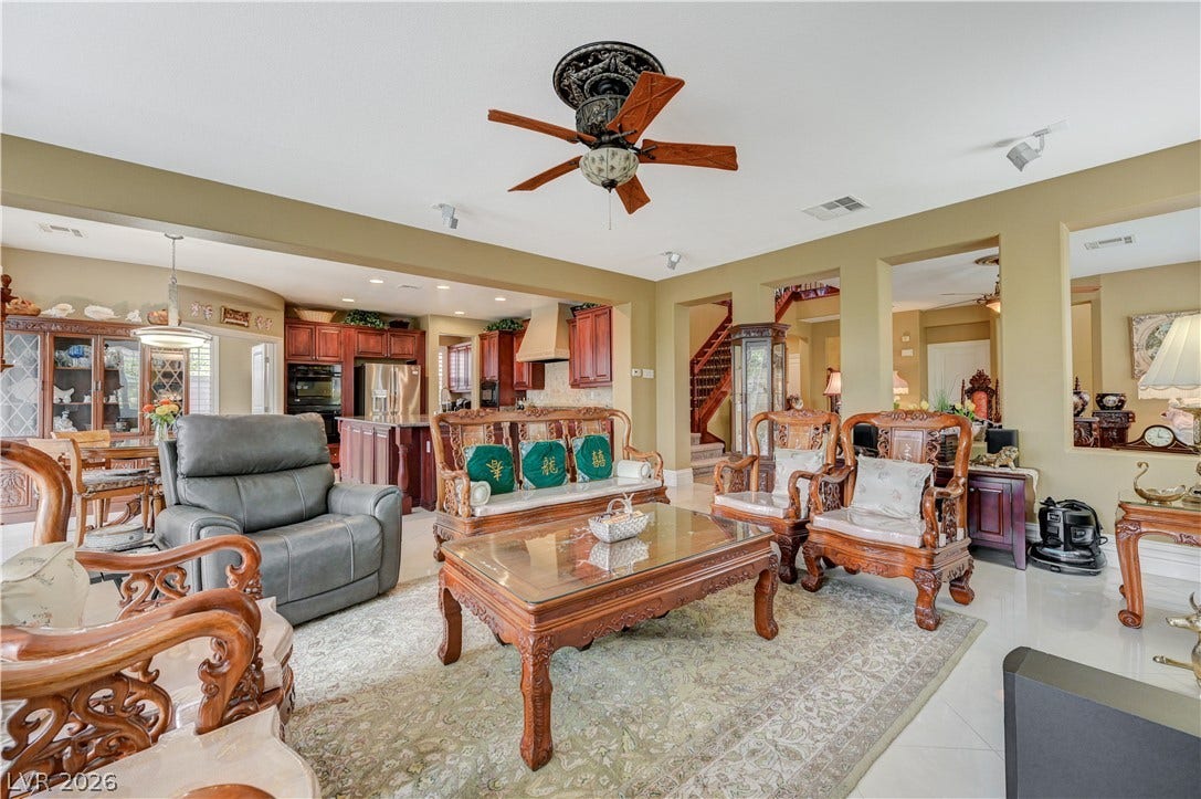 218 Crooked Putter Drive, Las Vegas, NV 89148 Gleaming tile floors and columns anchor this spacious open-concept living area.