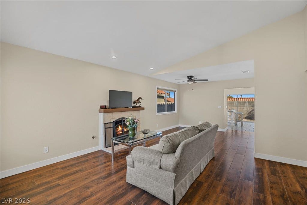 2432 Millcroft Drive, Henderson, NV 89074 Fireplace with living/dining rooms.