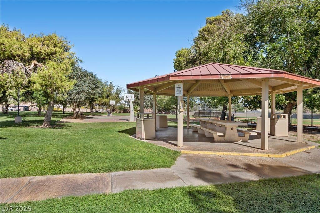 2432 Millcroft Drive, Henderson, NV 89074 A spacious covered picnic pavilion rests alongside green lawns and a basketball court.