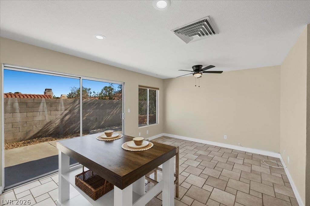 2432 Millcroft Drive, Henderson, NV 89074 Sliding glass doors open from the tiled den area directly to the private backyard.