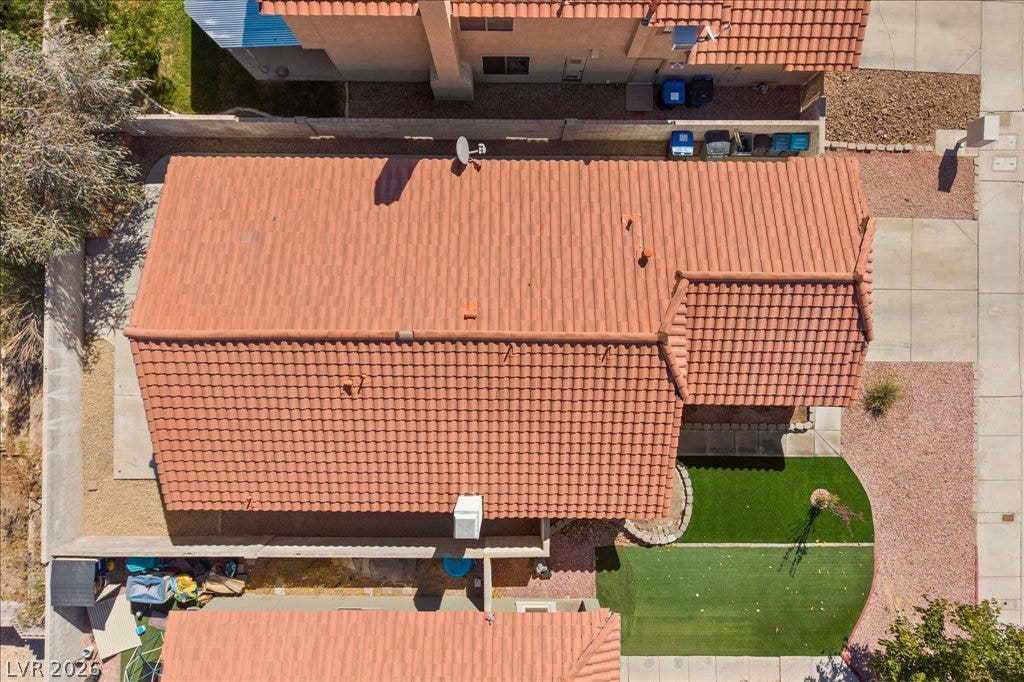 2432 Millcroft Drive, Henderson, NV 89074 An aerial perspective showcases the distinctive tile roof and surrounding yard of the property.