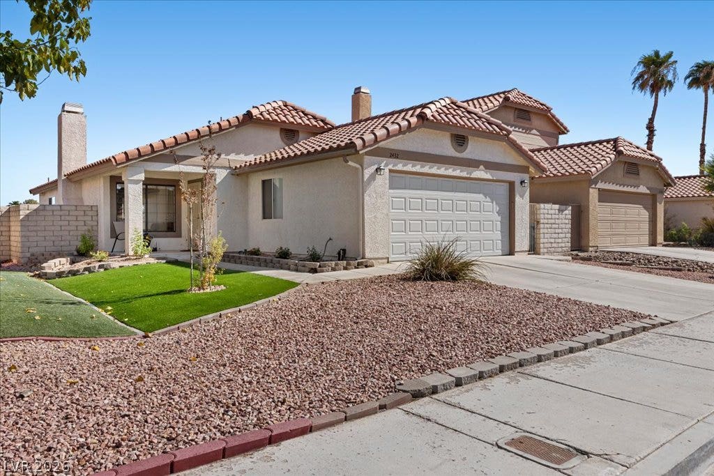2432 Millcroft Drive, Henderson, NV 89074 Exterior front of home with synthetic grass.